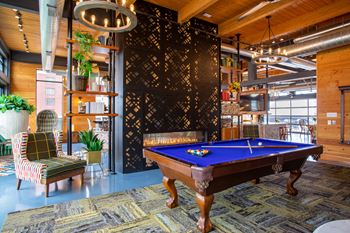a pool table in the lobby of a house